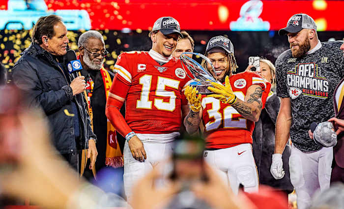 Chiefs stars Patrick Mahomes, Tyrann Mathieu and Travis Kelce celebrating with the Lamar Hunt Trophy after defeating the Titans in the AFC championship game